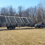 Medium sized rental bleachers compacted for transport and hitched on truck
