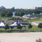 Ohio lakeside event with tents and portable bleachers set up