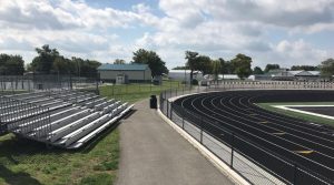 track and field event with portable bleachers