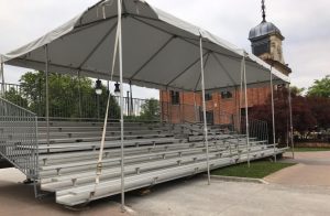 covered bleachers set up at outdoor auction